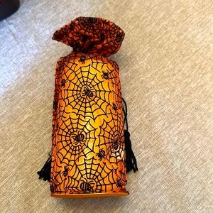 Bill Blass fragrance candle in reusable bag